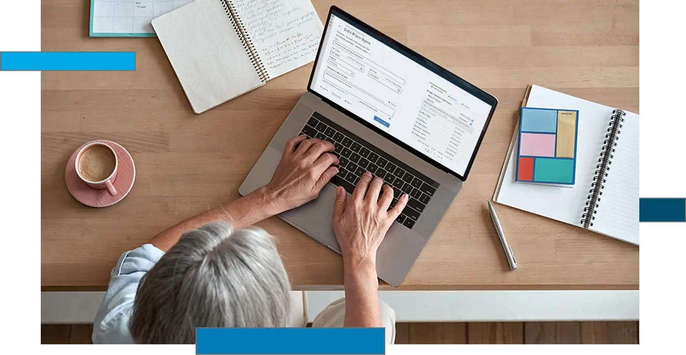 Overhead photo of a woman using Blackboard Planning on her laptop