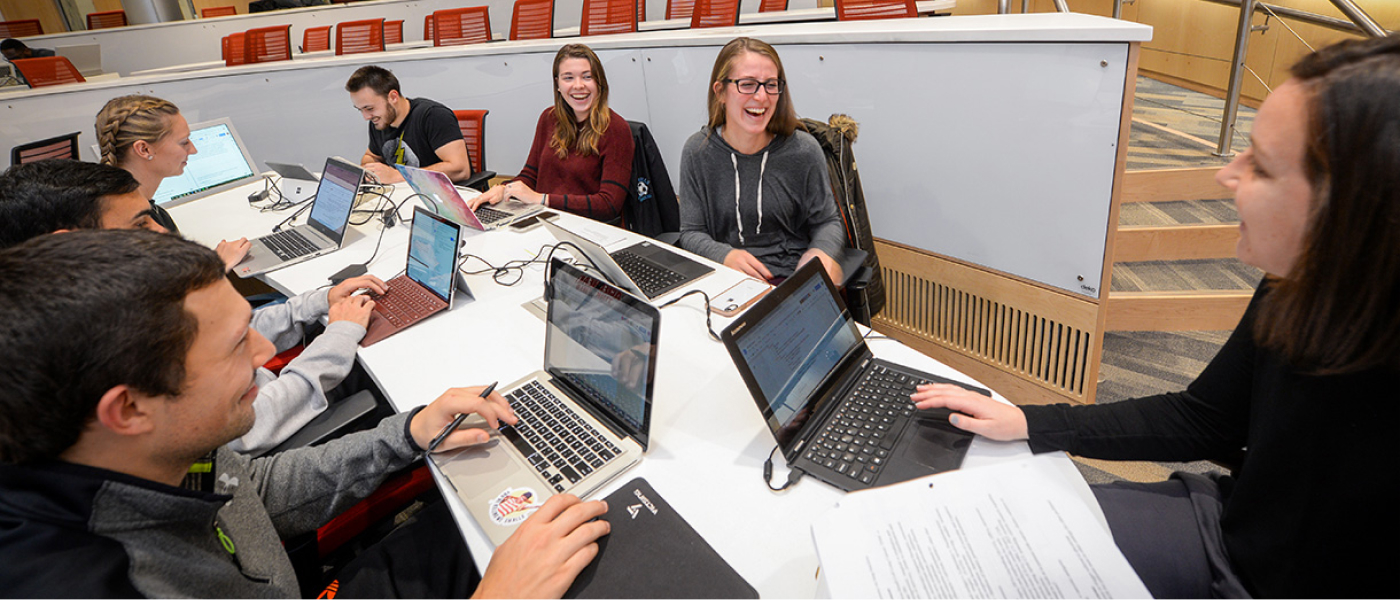 Faculty working in a conference room